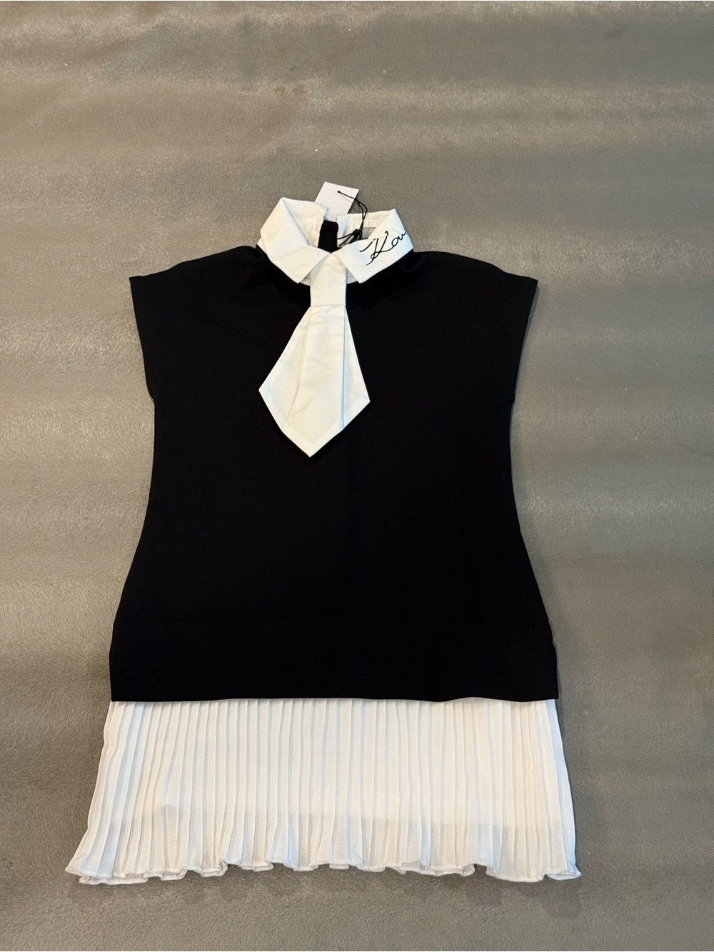 Karl Lagerfeld Black and White Knit Dress with Pleated Hem and Necktie Collar.